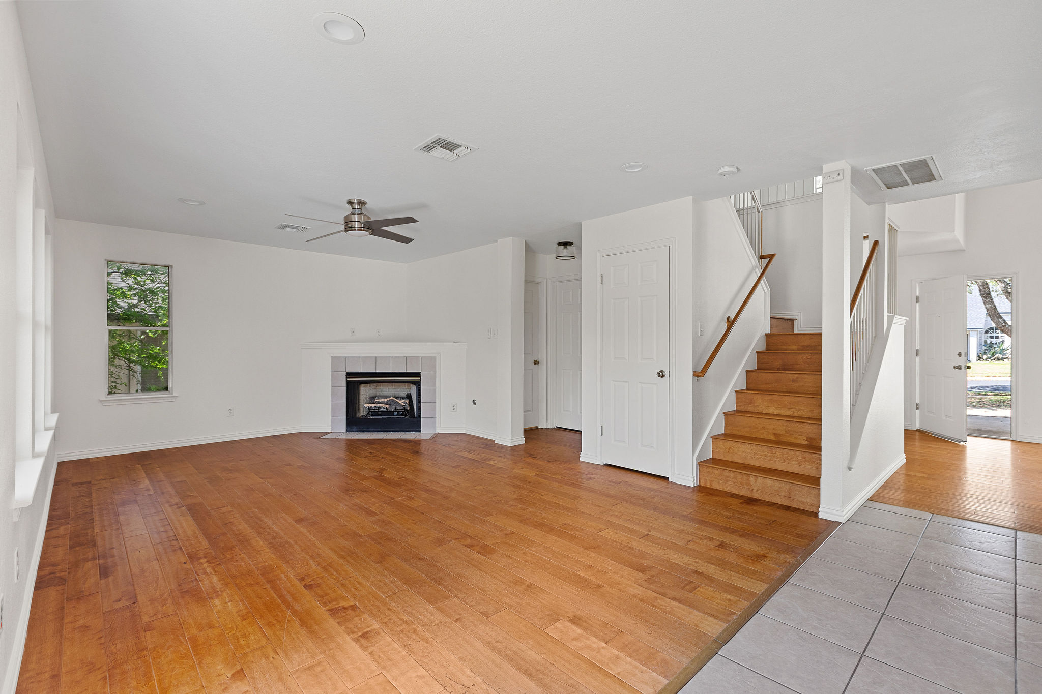 501 Shep Street Austin, TX 78748 - Photo 8 of 40 a view of a livingroom with wooden floor and staircase