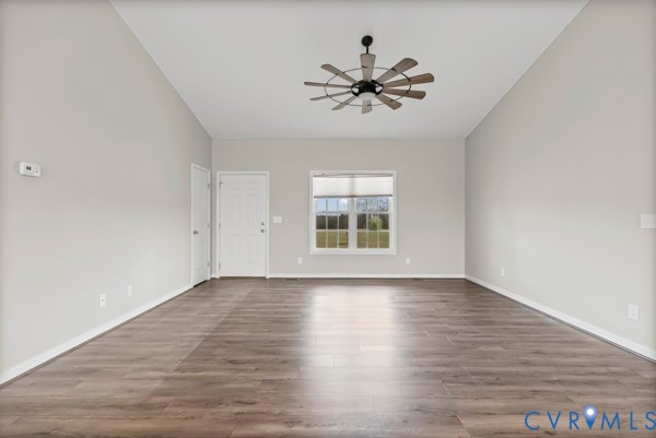 1251 Poorhouse Road Green Bay, VA 23942 - Photo 14 of 40 a view of an empty room with wooden floor and a window