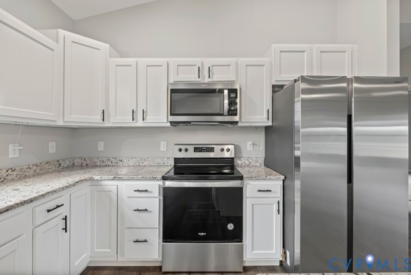 1251 Poorhouse Road Green Bay, VA 23942 - Photo 18 of 40 a kitchen with a stove microwave and refrigerator