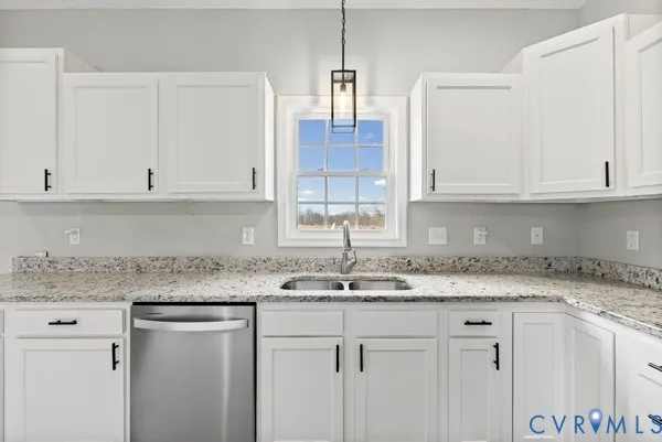 a view of a kitchen counter space and chandelier