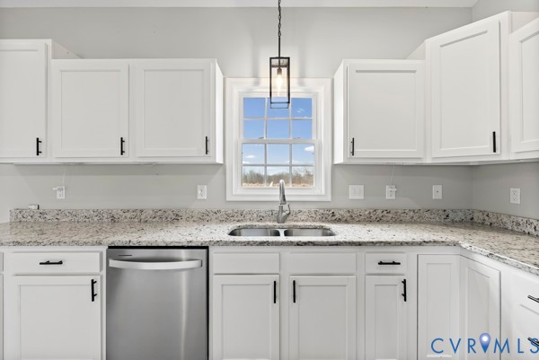 1251 Poorhouse Road Green Bay, VA 23942 - Photo 19 of 40 a kitchen with granite countertop white cabinets and a sink
