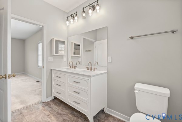 1251 Poorhouse Road Green Bay, VA 23942 - Photo 26 of 40 a bathroom with a toilet sink and mirror
