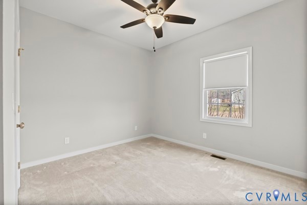 1251 Poorhouse Road Green Bay, VA 23942 - Photo 29 of 40 an empty room with a window and a fan