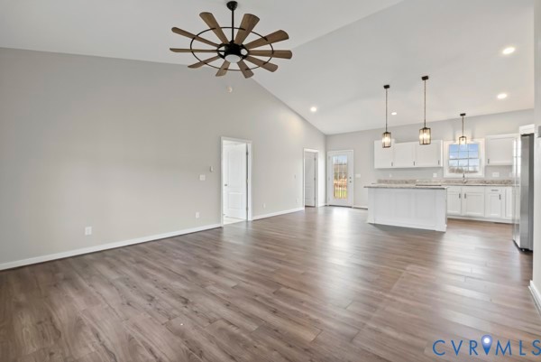 1251 Poorhouse Road Green Bay, VA 23942 - Photo 10 of 40 a view of a kitchen with a dishwasher a kitchen island hardwood floor and a window