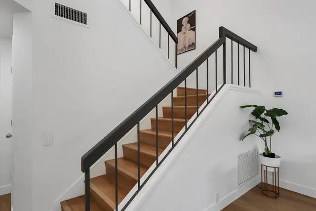 a view of a hallway with stairs