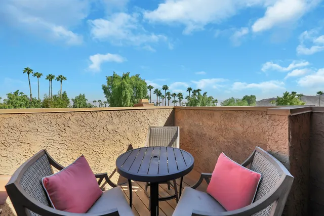 a view of swimming pool and outdoor seating