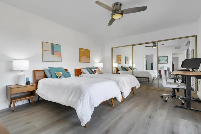 a bed room with a bed and a chandelier