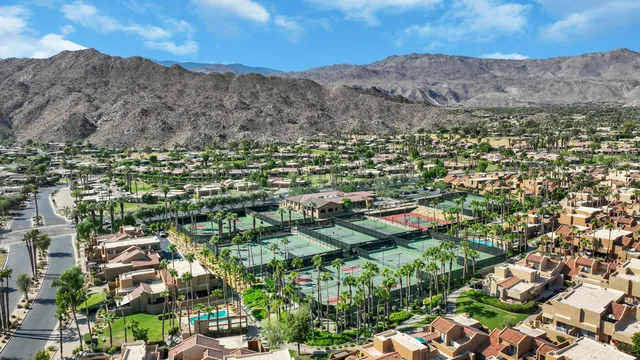 a view of a city with mountains in the background