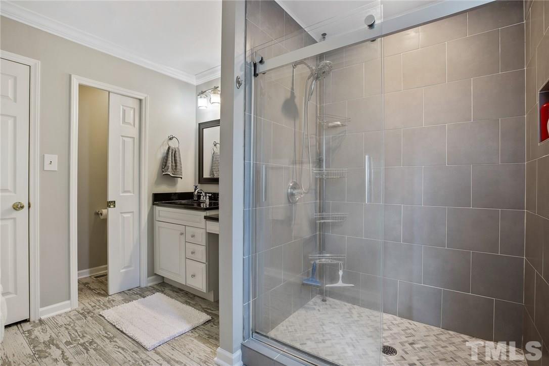 3015 Iron Works Road Reidsville, NC 27320 - Photo 22 of 30 a bathroom with a shower and a sink