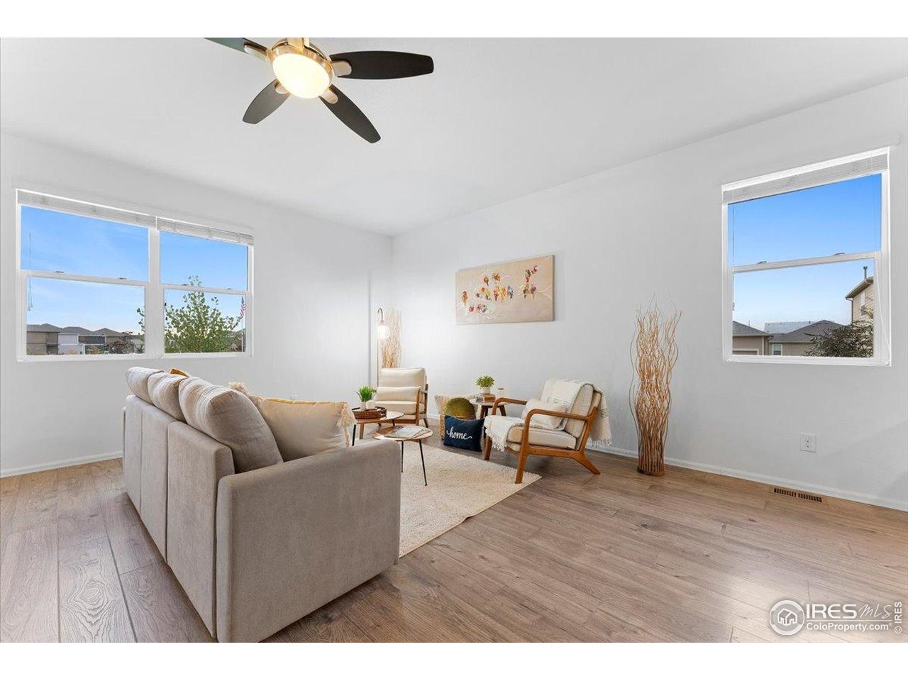 501 Buckrake Street Severance, CO 80550 - Photo 17 of 50 a living room with furniture and a wooden floor