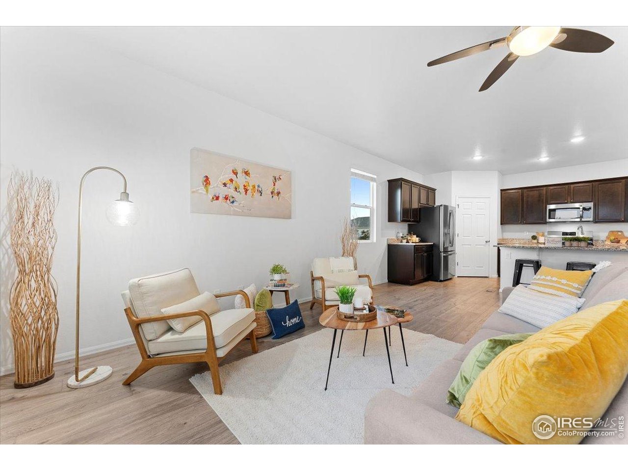 501 Buckrake Street Severance, CO 80550 - Photo 21 of 50 a living room with furniture and kitchen view