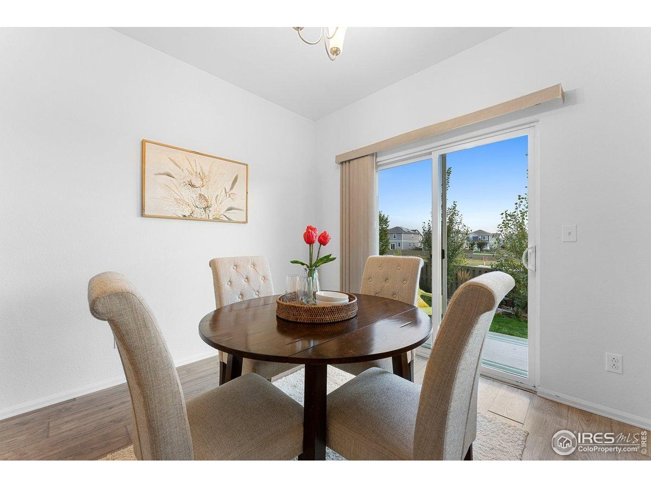 501 Buckrake Street Severance, CO 80550 - Photo 22 of 50 a dining room with furniture and wooden floor