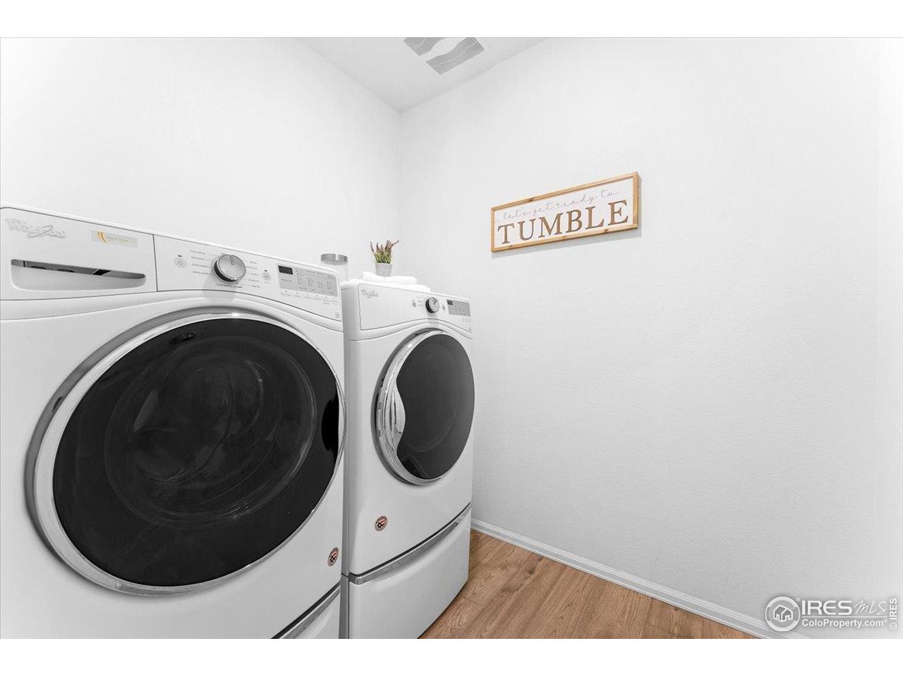 501 Buckrake Street Severance, CO 80550 - Photo 24 of 50 a view of a hallway with washer and dryer