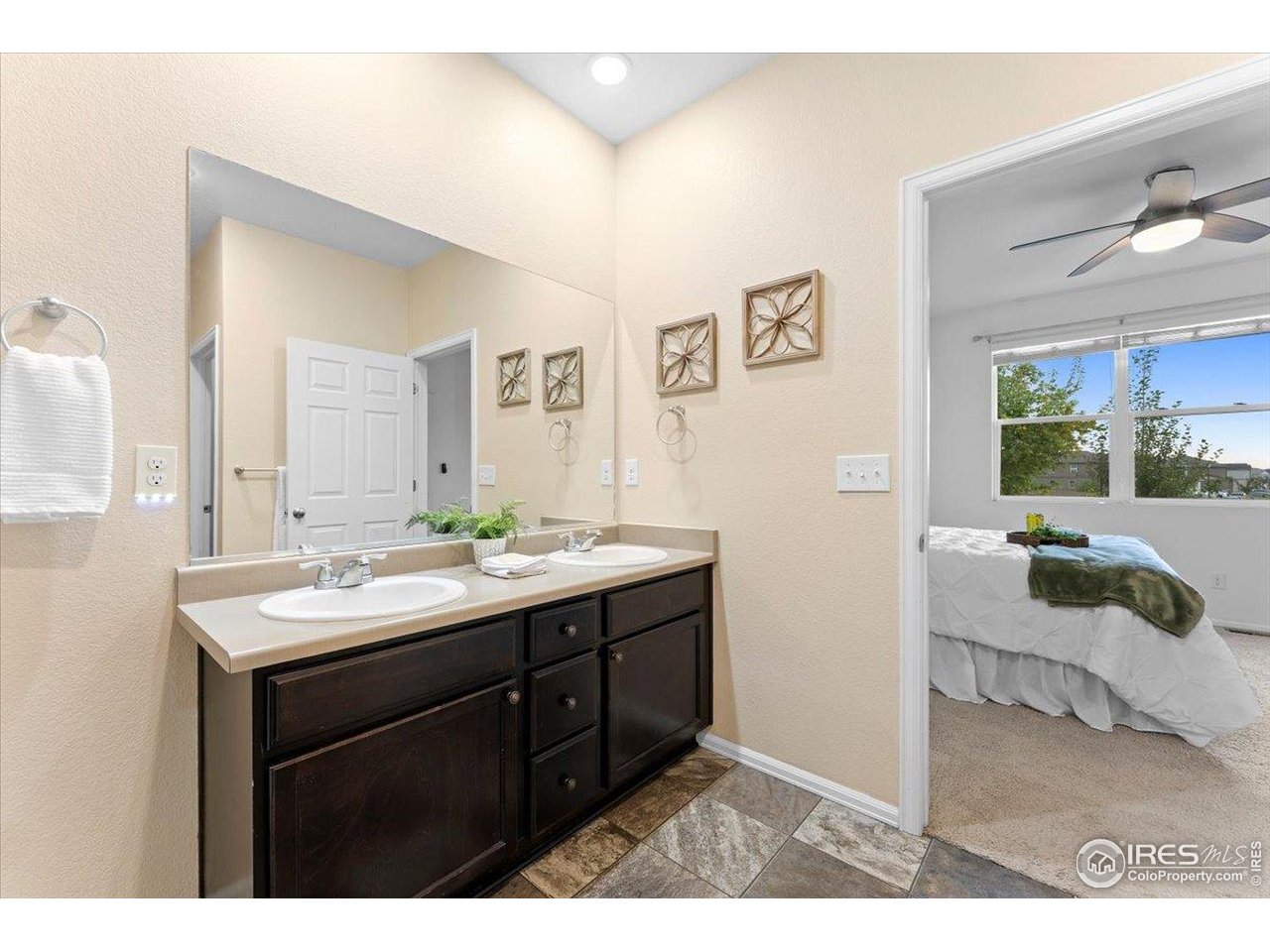 501 Buckrake Street Severance, CO 80550 - Photo 30 of 50 a bathroom with a sink and a mirror