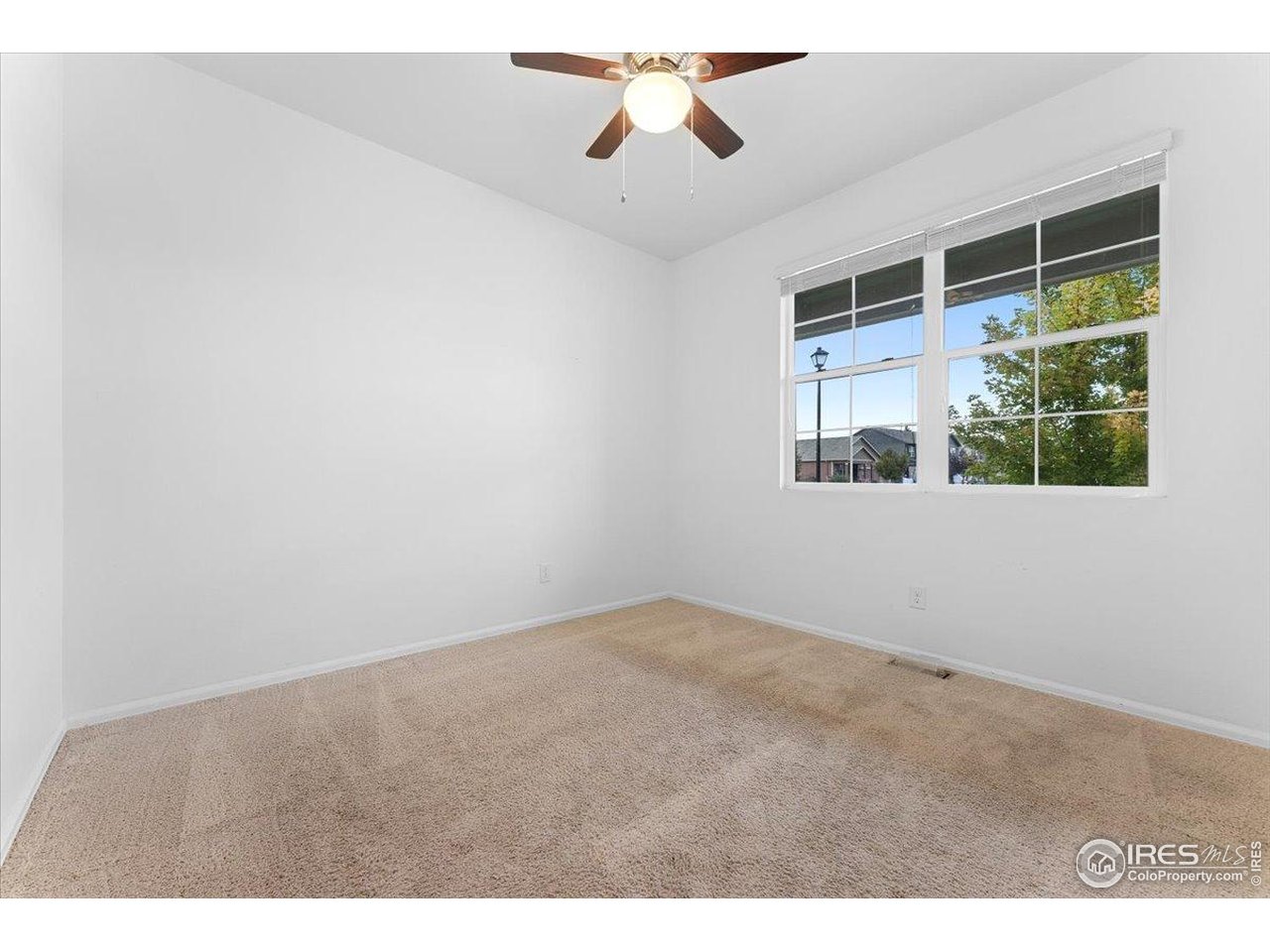 501 Buckrake Street Severance, CO 80550 - Photo 35 of 50 an empty room with windows and entrance
