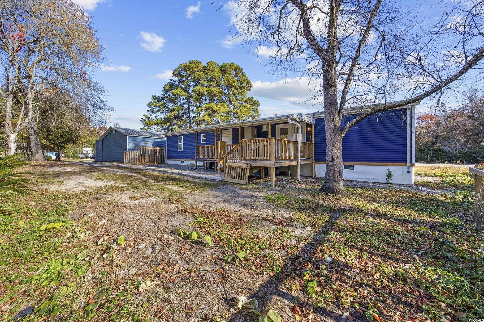 4221 Blake Road Myrtle Beach, SC 29588 - Photo 27 of 36 Back of property with a wooden deck