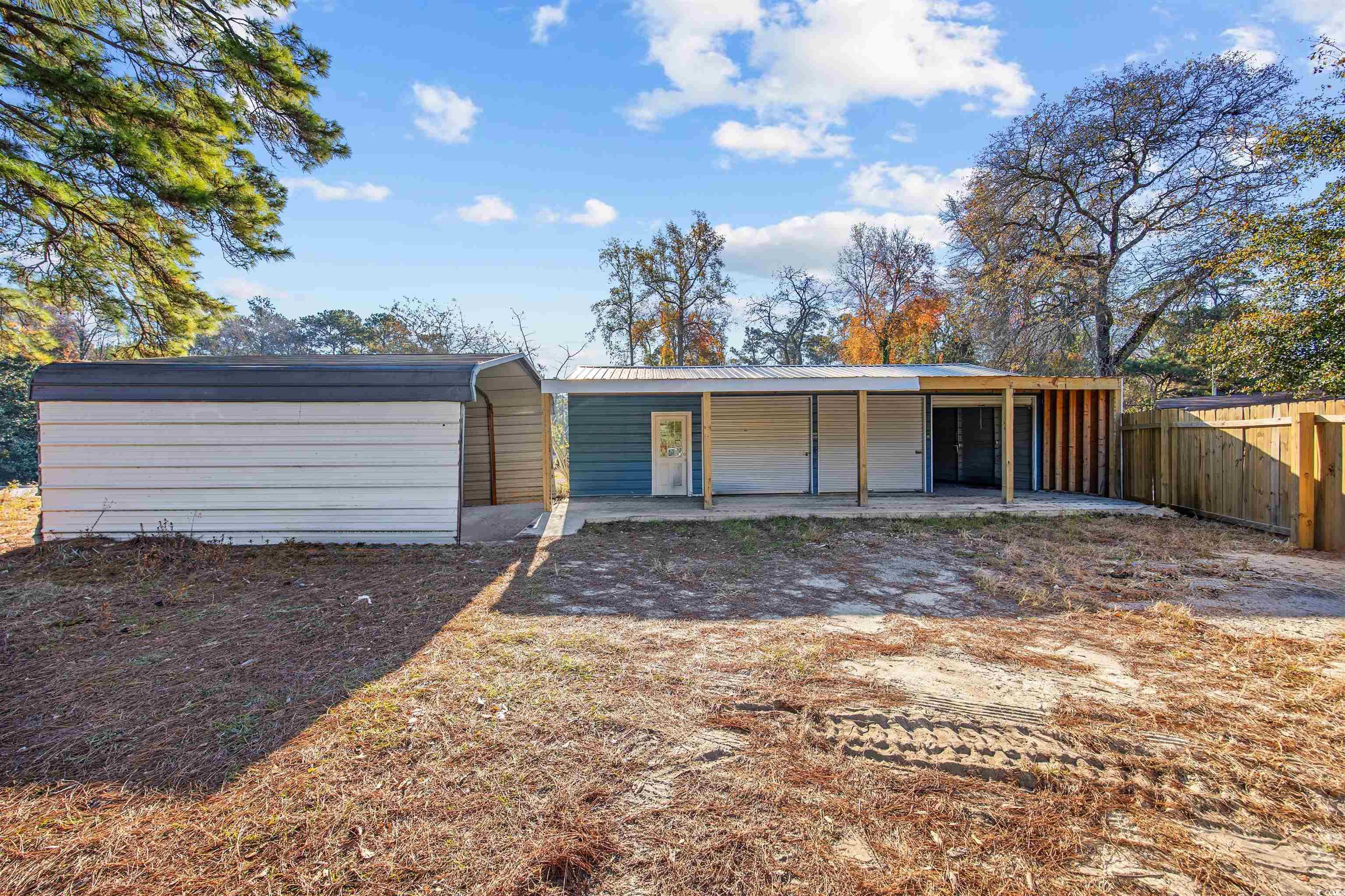 4221 Blake Road Myrtle Beach, SC 29588 - Photo 30 of 36 Rear view of house with a patio area