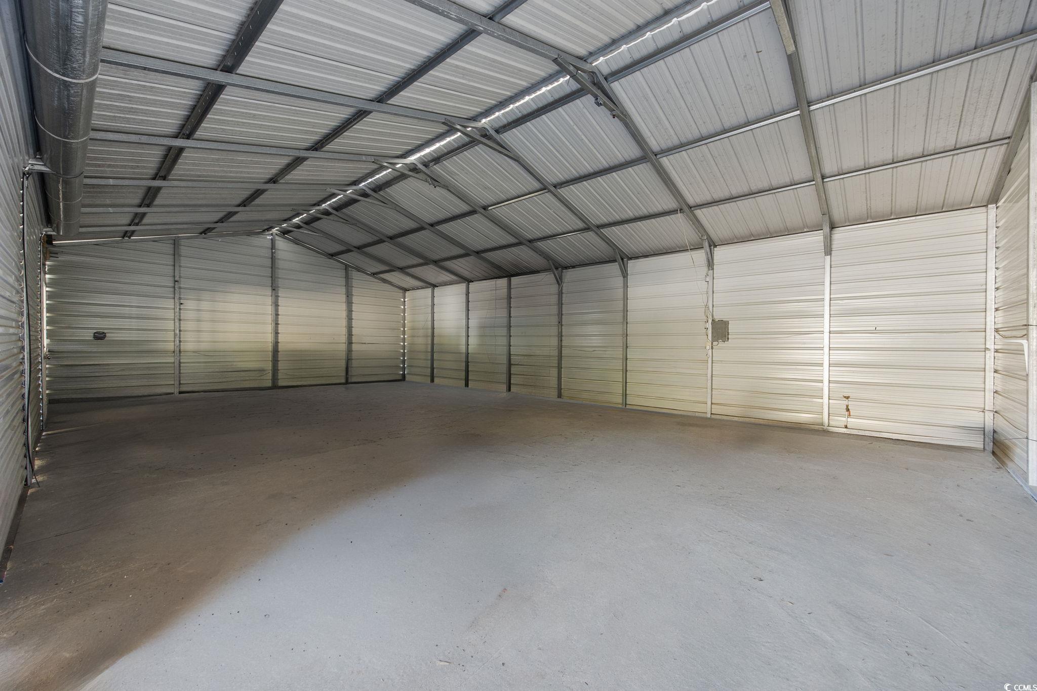 4221 Blake Road Myrtle Beach, SC 29588 - Photo 31 of 36 Garage featuring metal wall