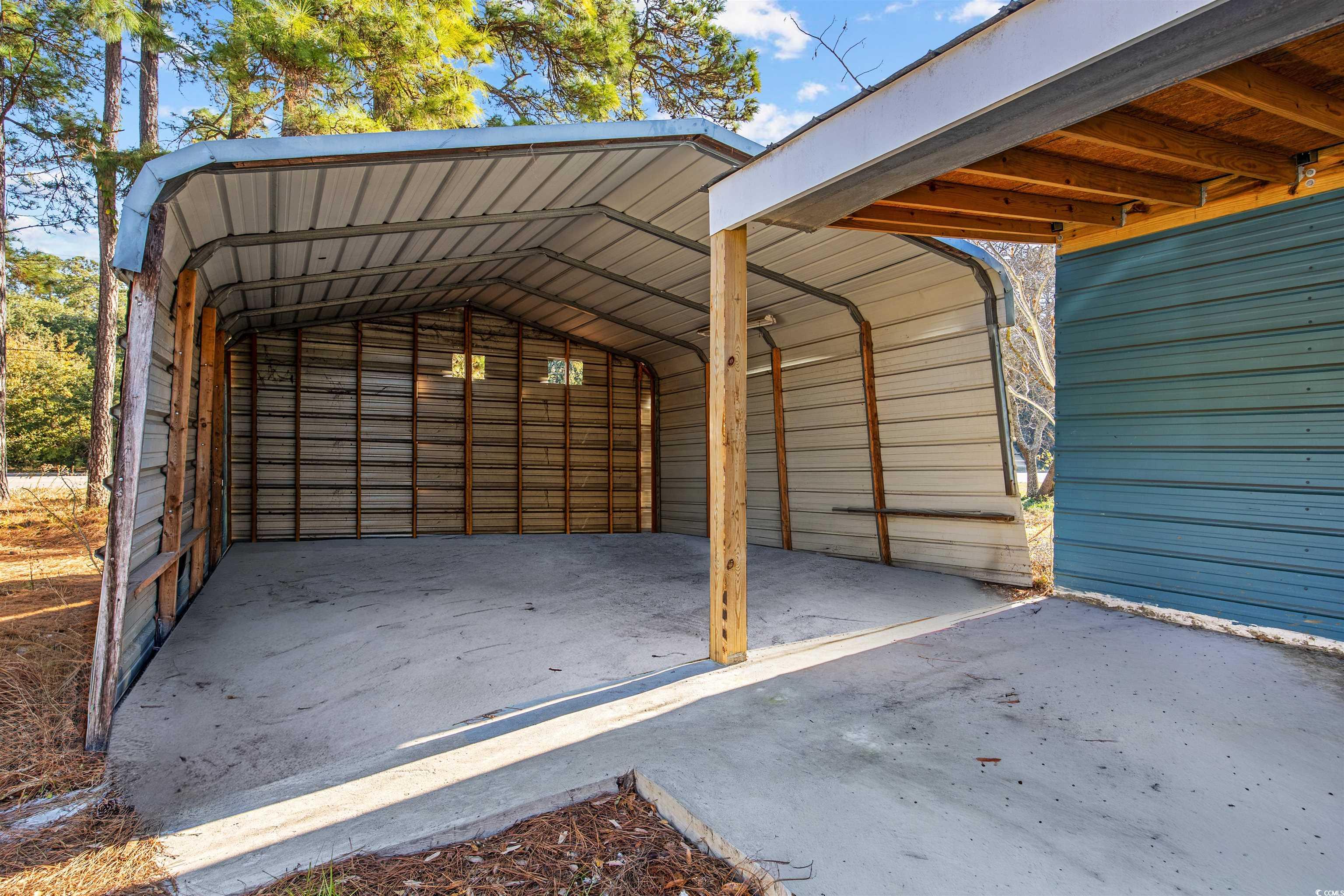 4221 Blake Road Myrtle Beach, SC 29588 - Photo 33 of 36 View of parking with a detached carport