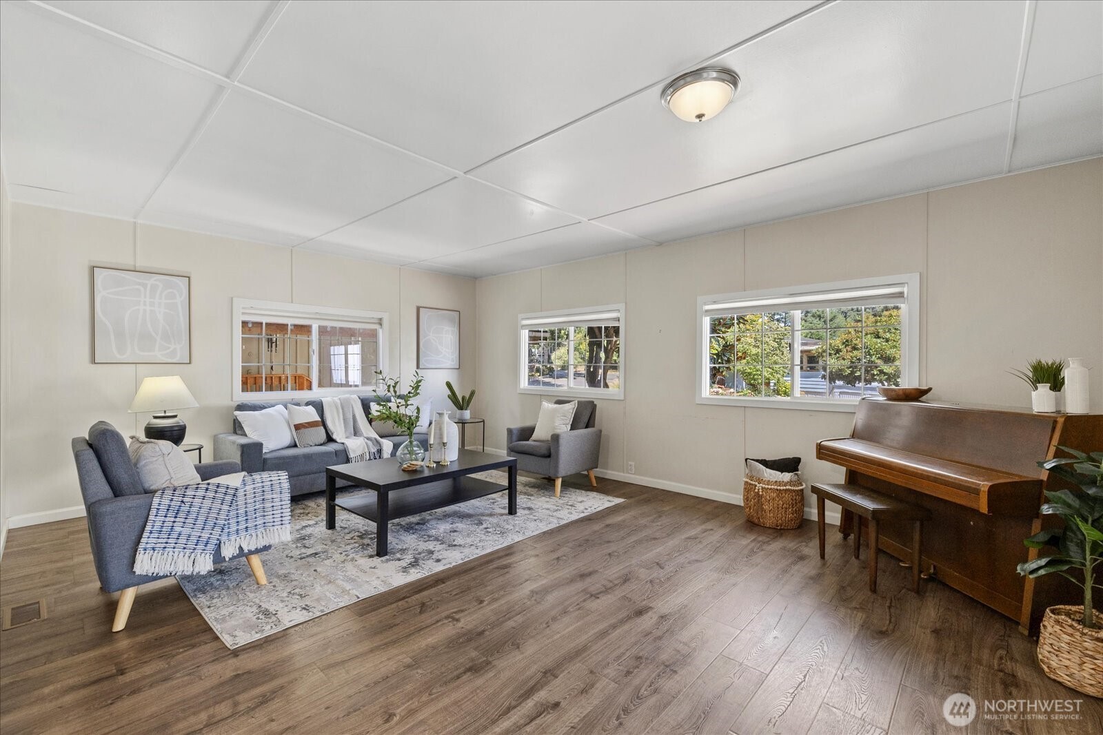 7301 Northeast 175th Street Kenmore, WA 98028 - Photo 12 of 28 a living room with furniture and a wooden floor