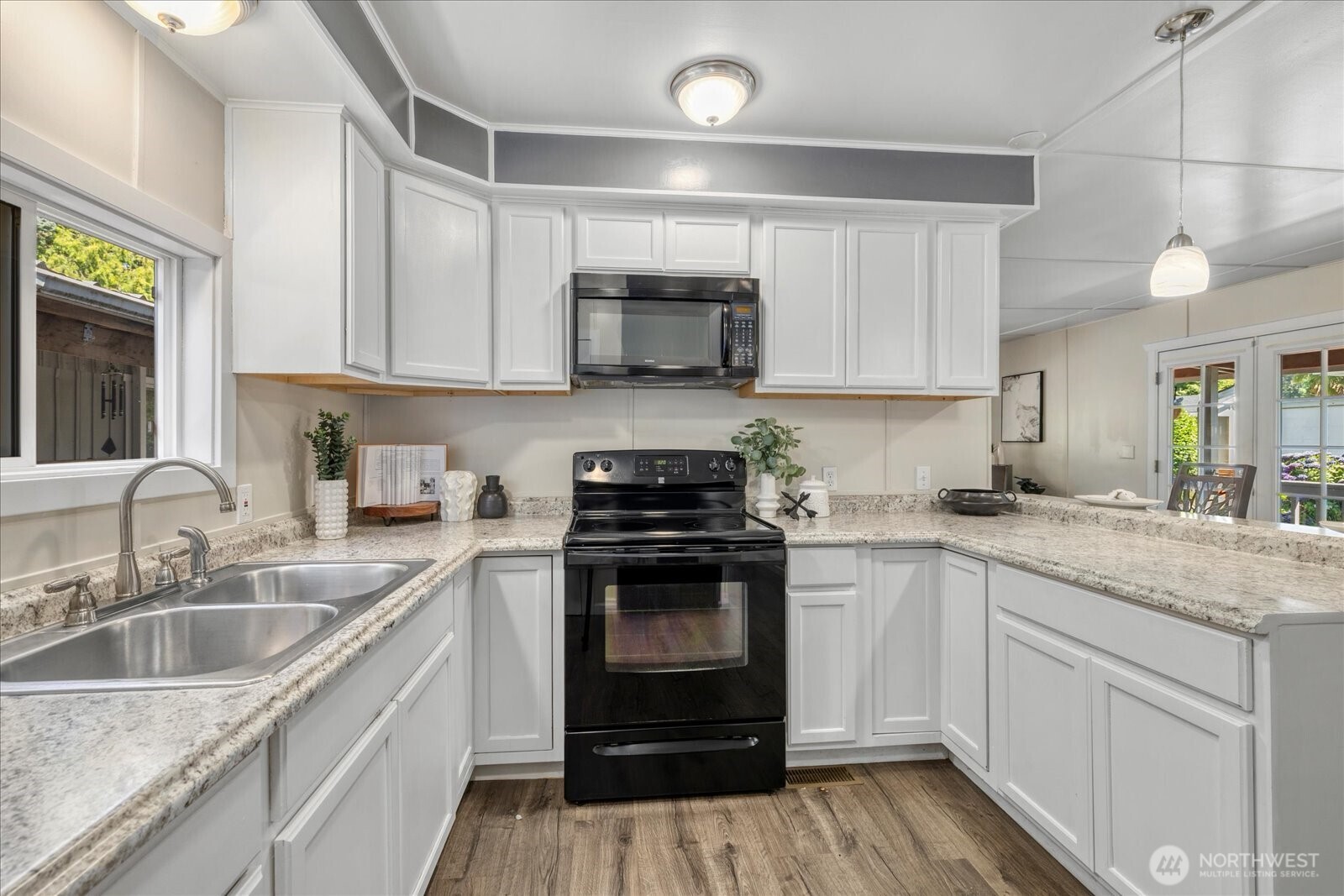 7301 Northeast 175th Street Kenmore, WA 98028 - Photo 17 of 28 a kitchen with a sink stove and cabinets