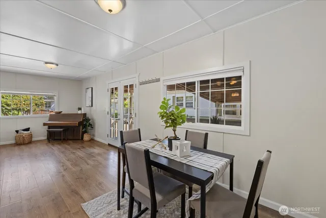 a view of a dining room with furniture window and outside view