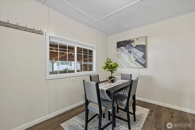 a dining room with furniture and window