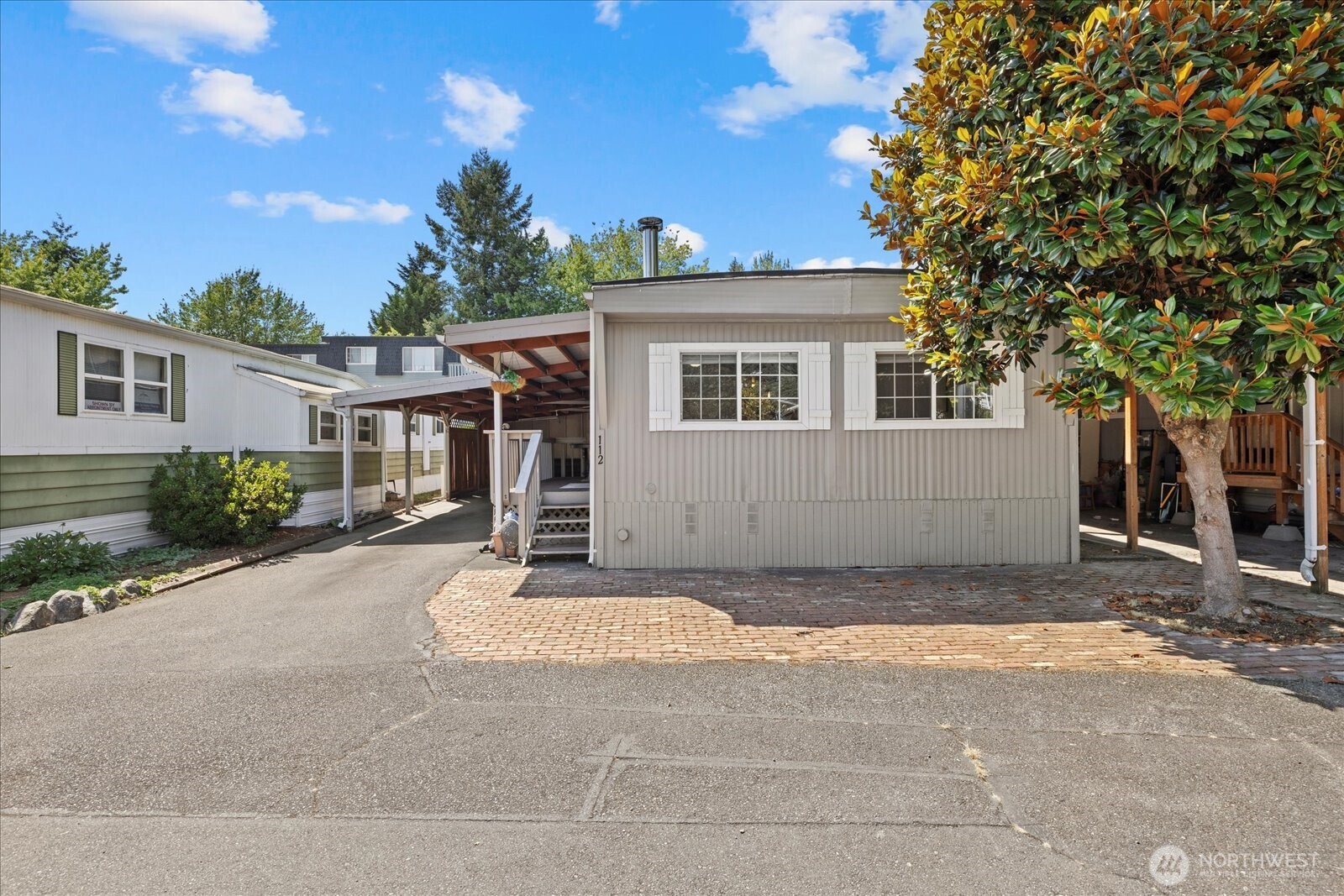 7301 Northeast 175th Street Kenmore, WA 98028 - Photo 2 of 28 a view of a house with backyard and trees