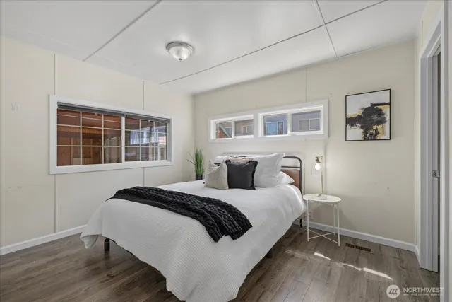 a bedroom with a bed and a window