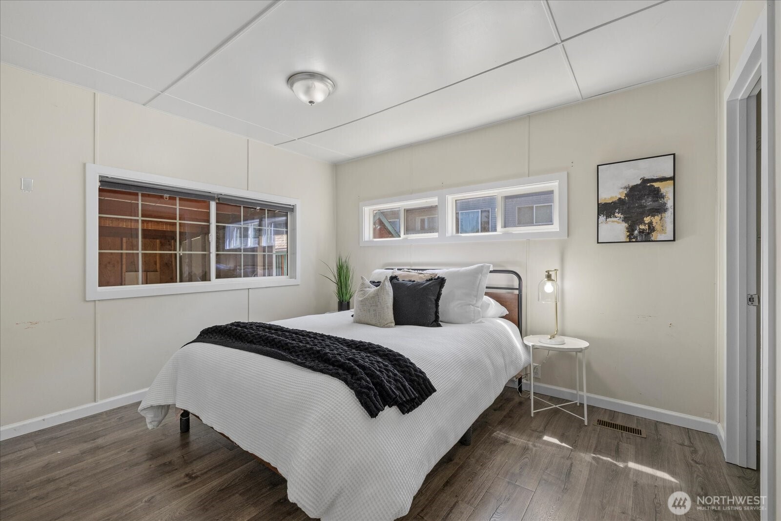 7301 Northeast 175th Street Kenmore, WA 98028 - Photo 22 of 28 a bedroom with a bed and a window