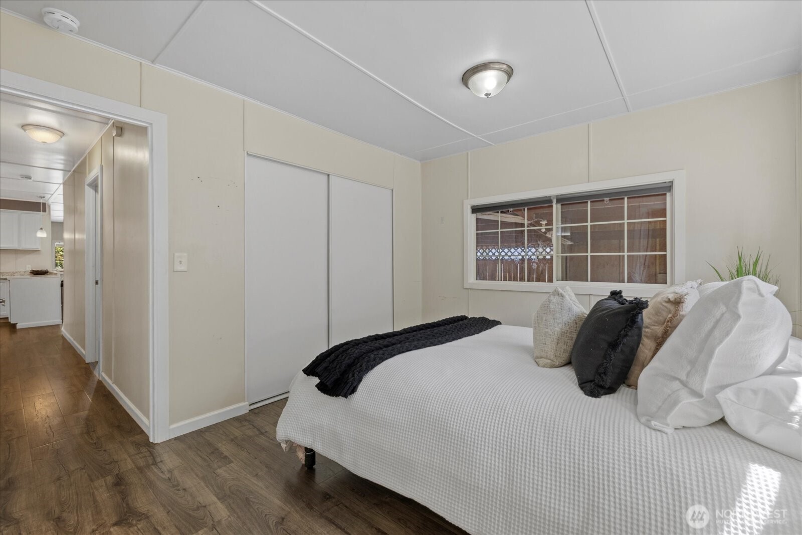 7301 Northeast 175th Street Kenmore, WA 98028 - Photo 24 of 28 a bedroom with a bed and a window