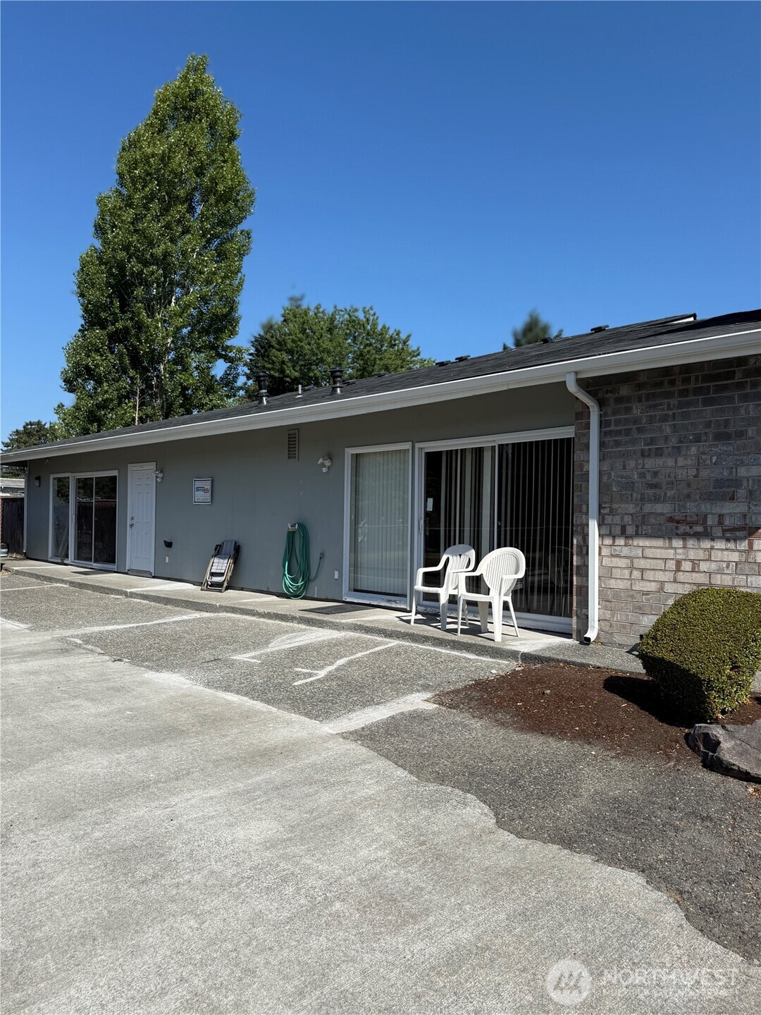 7301 Northeast 175th Street Kenmore, WA 98028 - Photo 28 of 28 a view of a house with backyard and a car parked