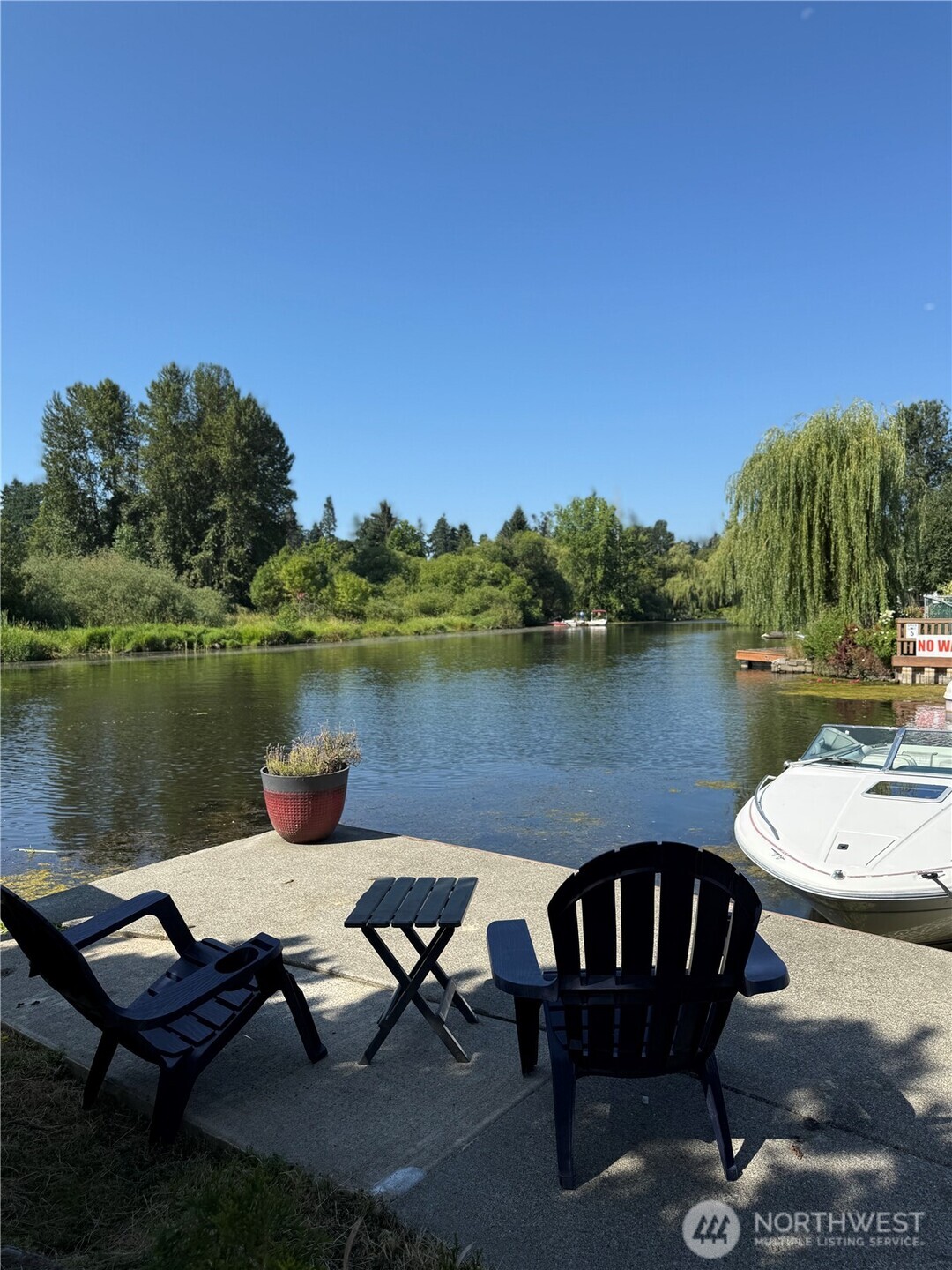 7301 Northeast 175th Street Kenmore, WA 98028 - Photo 3 of 28 a view of a lake with outdoor seating