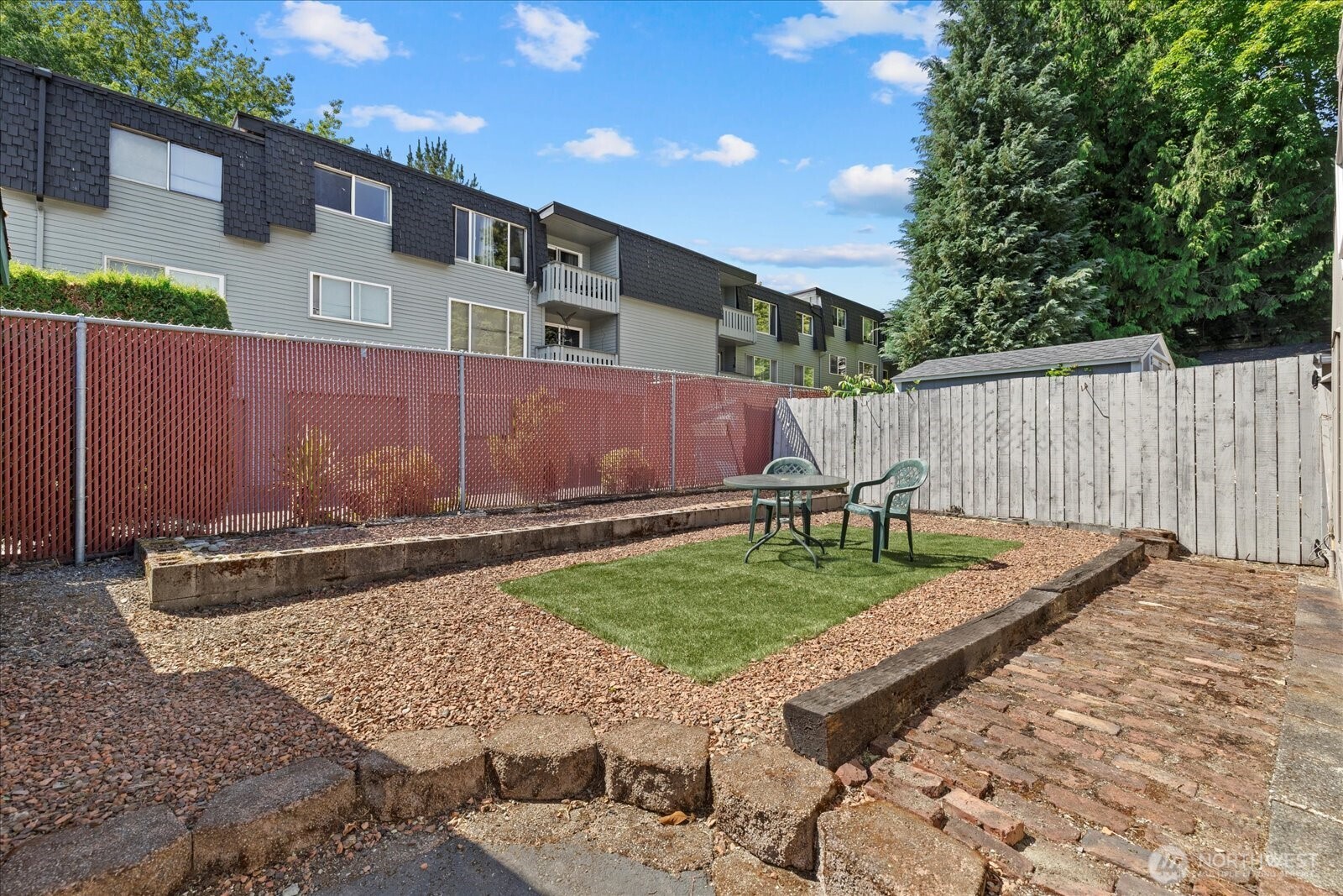 7301 Northeast 175th Street Kenmore, WA 98028 - Photo 5 of 28 a view of a backyard with wooden fence