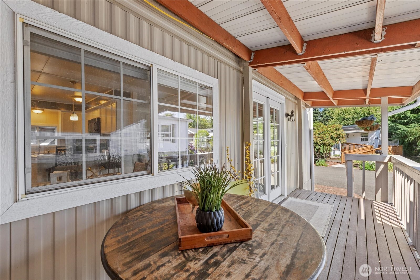 7301 Northeast 175th Street Kenmore, WA 98028 - Photo 9 of 28 a view of a living room and a large window with wooden floor