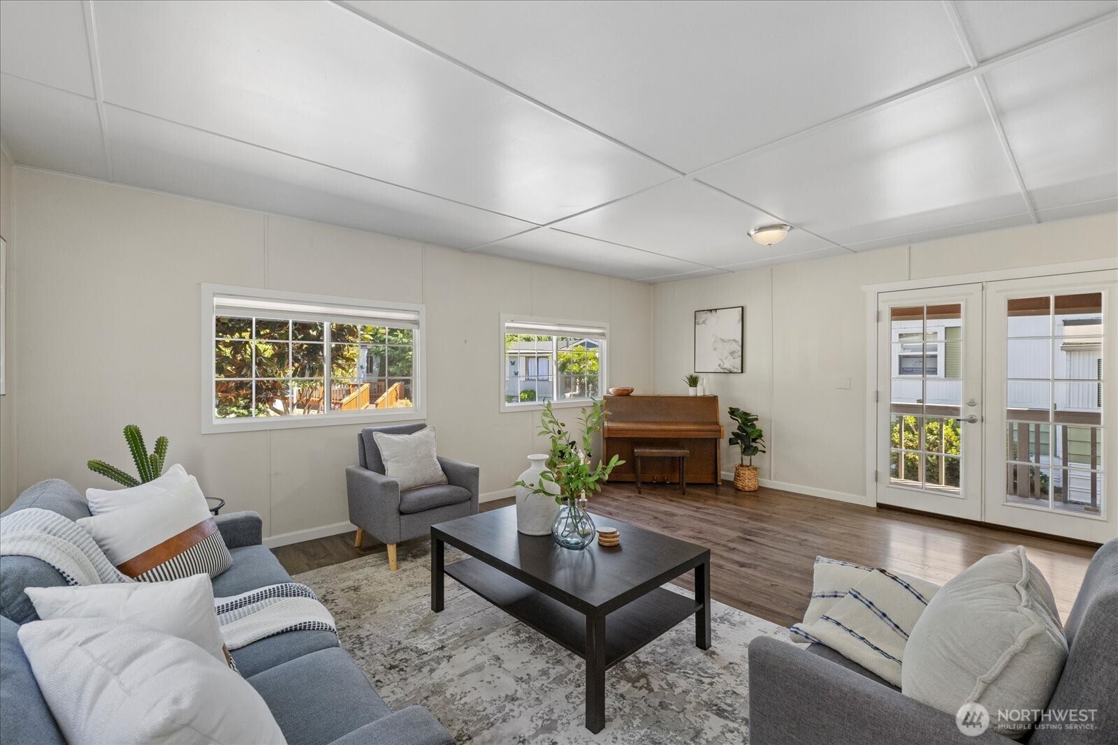 7301 Northeast 175th Street Kenmore, WA 98028 - Photo 10 of 28 a living room with furniture and a wooden floor