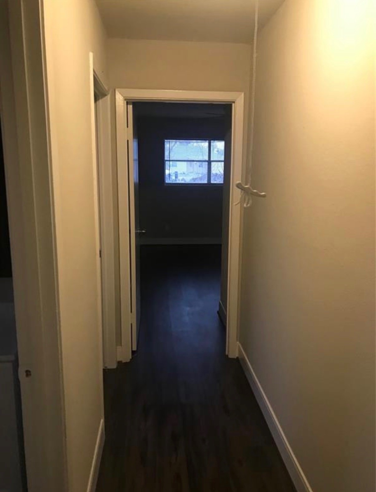 7230 England Street Houston, TX 77021 - Photo 15 of 15 a view of a hallway with wooden floor and a window