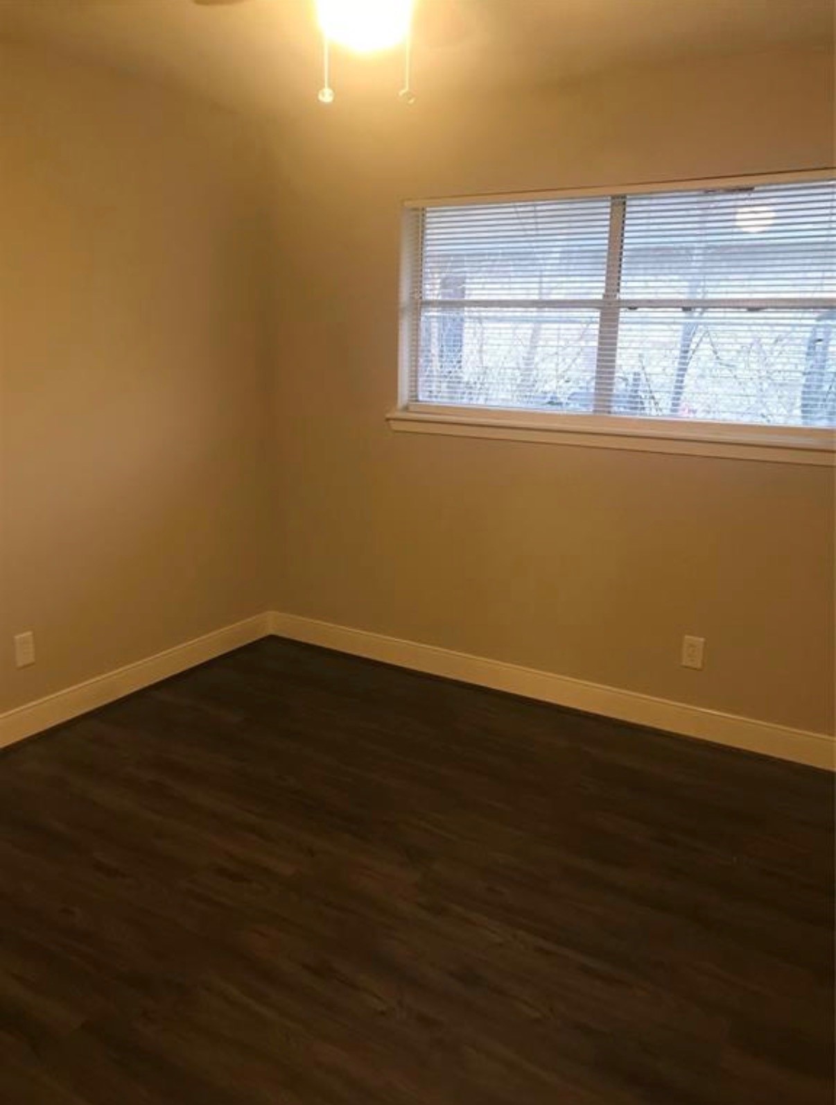 7230 England Street Houston, TX 77021 - Photo 10 of 15 an empty room with wooden floor and windows