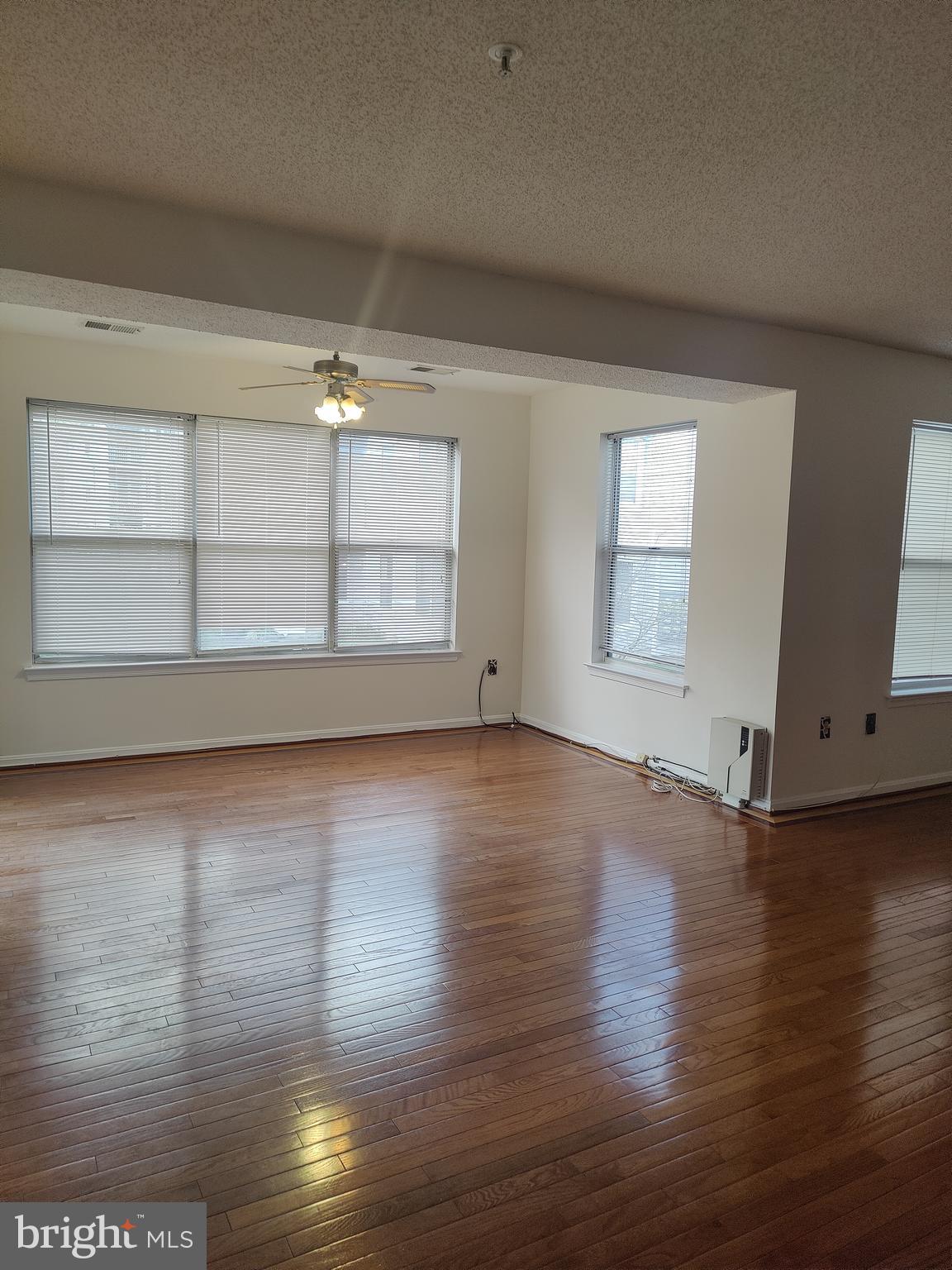 14202 Wolf Creek Place, Unit 726 Silver Spring, MD 20906 - Photo 6 of 20 Natural light in the dining & living area
