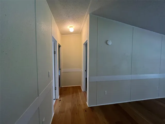 a view of a house with backyard and a tree