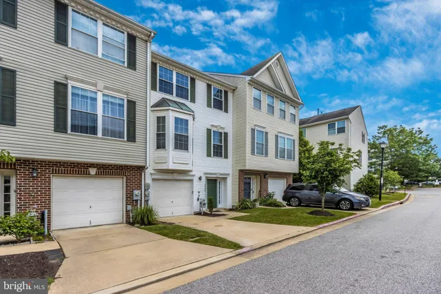 a front view of a house with yard