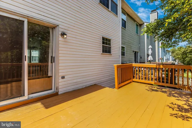 a view of a house with wooden fence