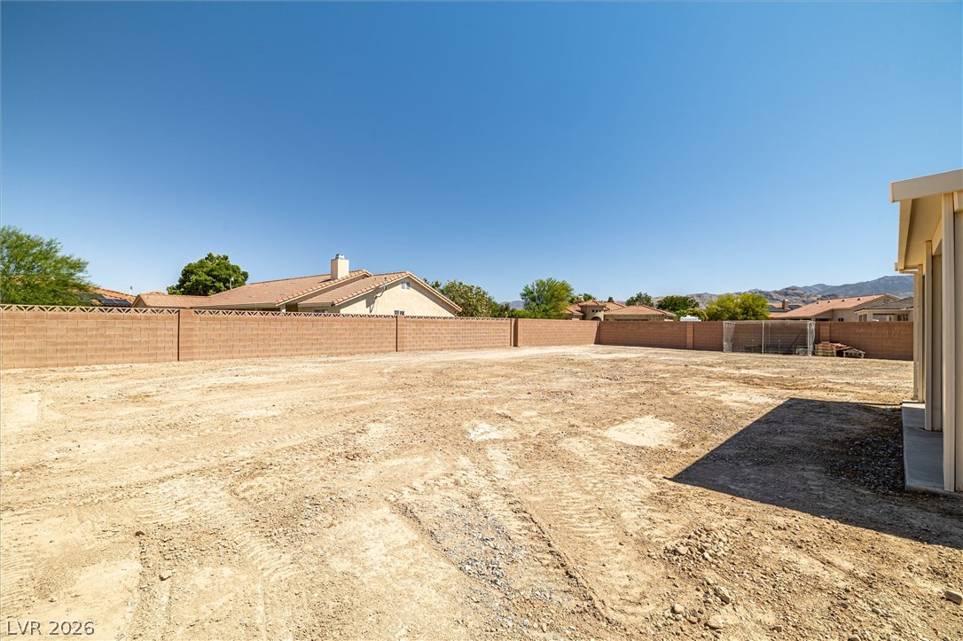 6720 Stubblefield Drive Pahrump, NV 89061 - Photo 34 of 51 A spacious, unimproved yard, offering a blank canvas for custom landscaping.