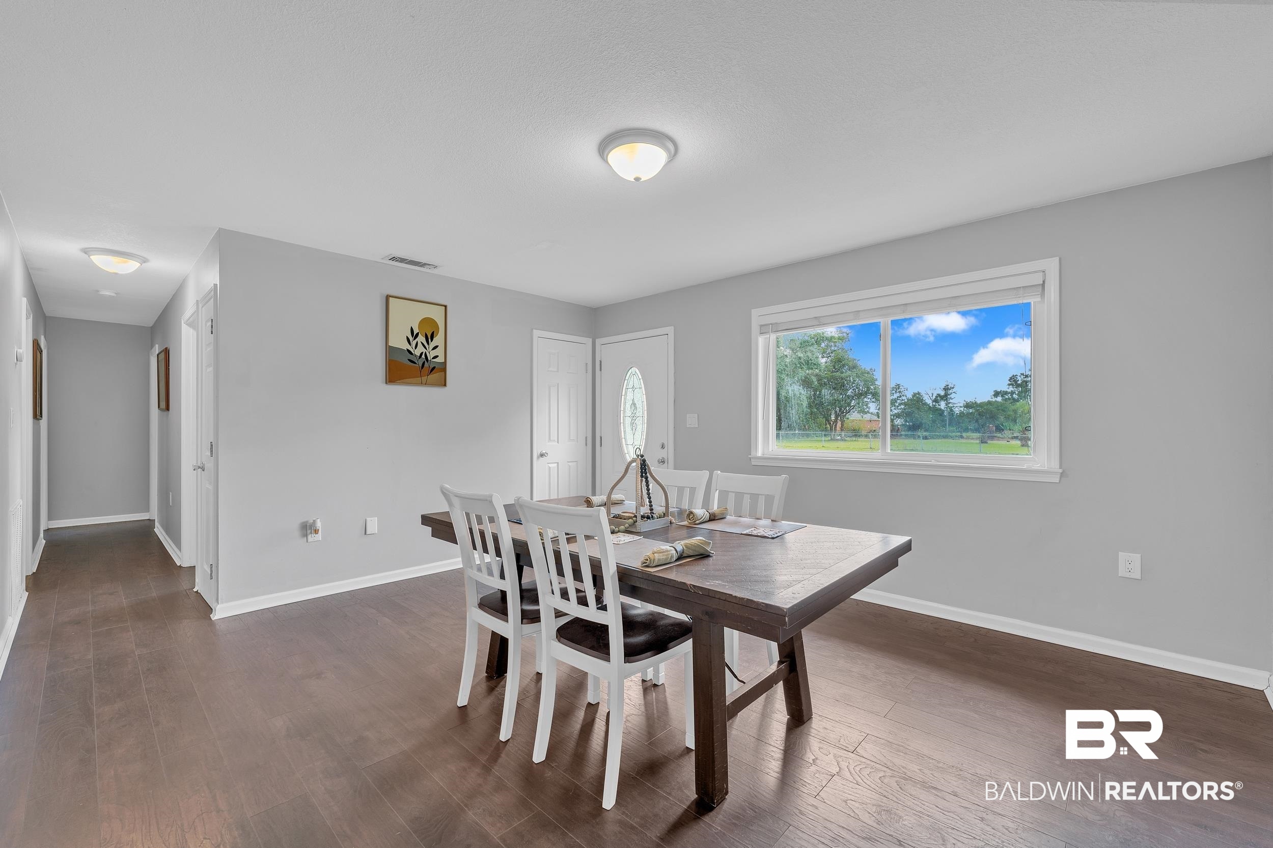 206 West Jackson Avenue Summerdale, AL 36580 - Photo 18 of 37 Dining space featuring baseboards and dark wood-style flooring