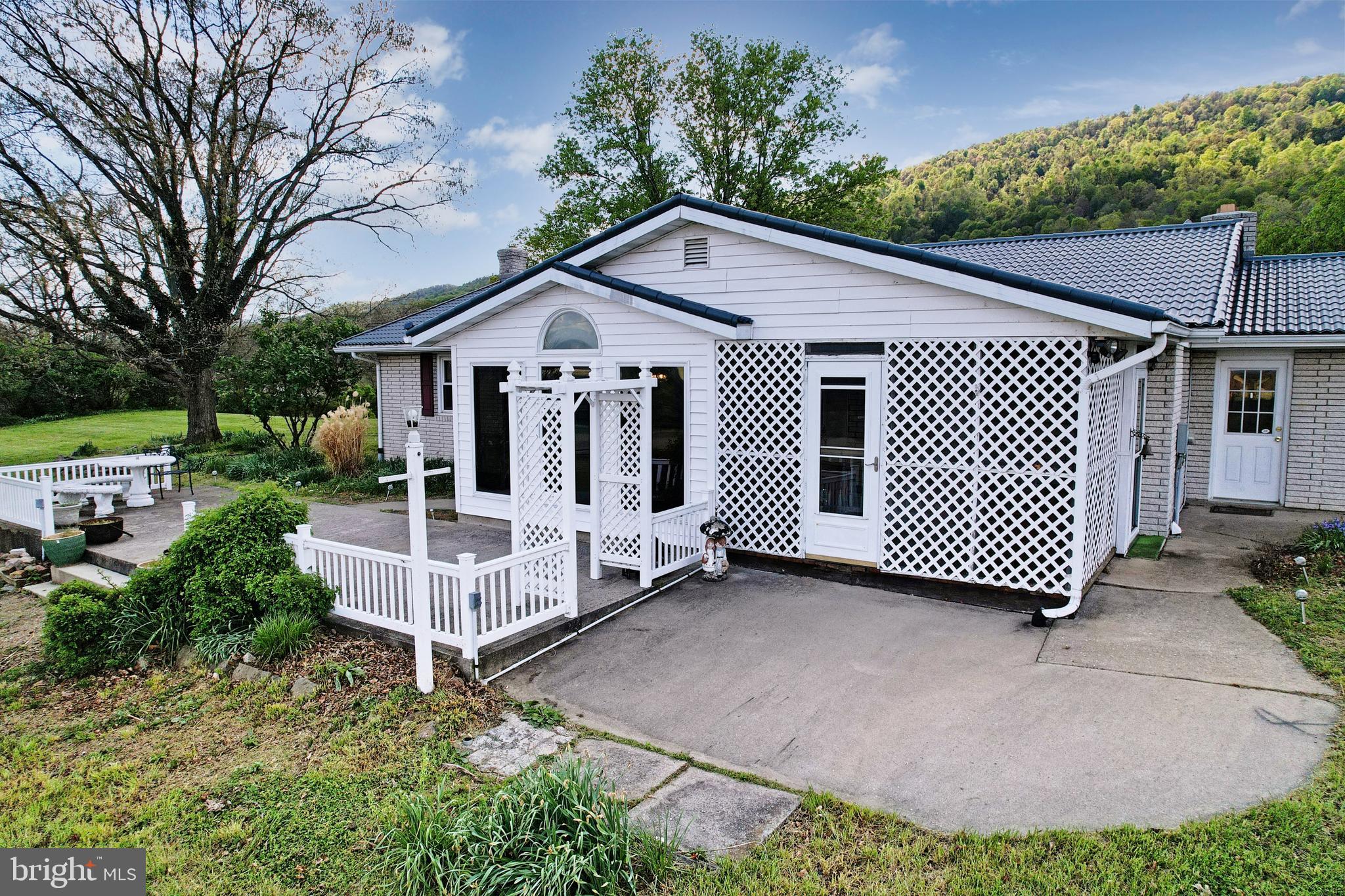 7977 Knobley Road Keyser, WV 26726 - Photo 7 of 44 Multiple Porch and Patio Areas!