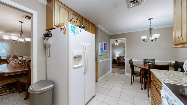 a very nice looking dining room with a table and chairs