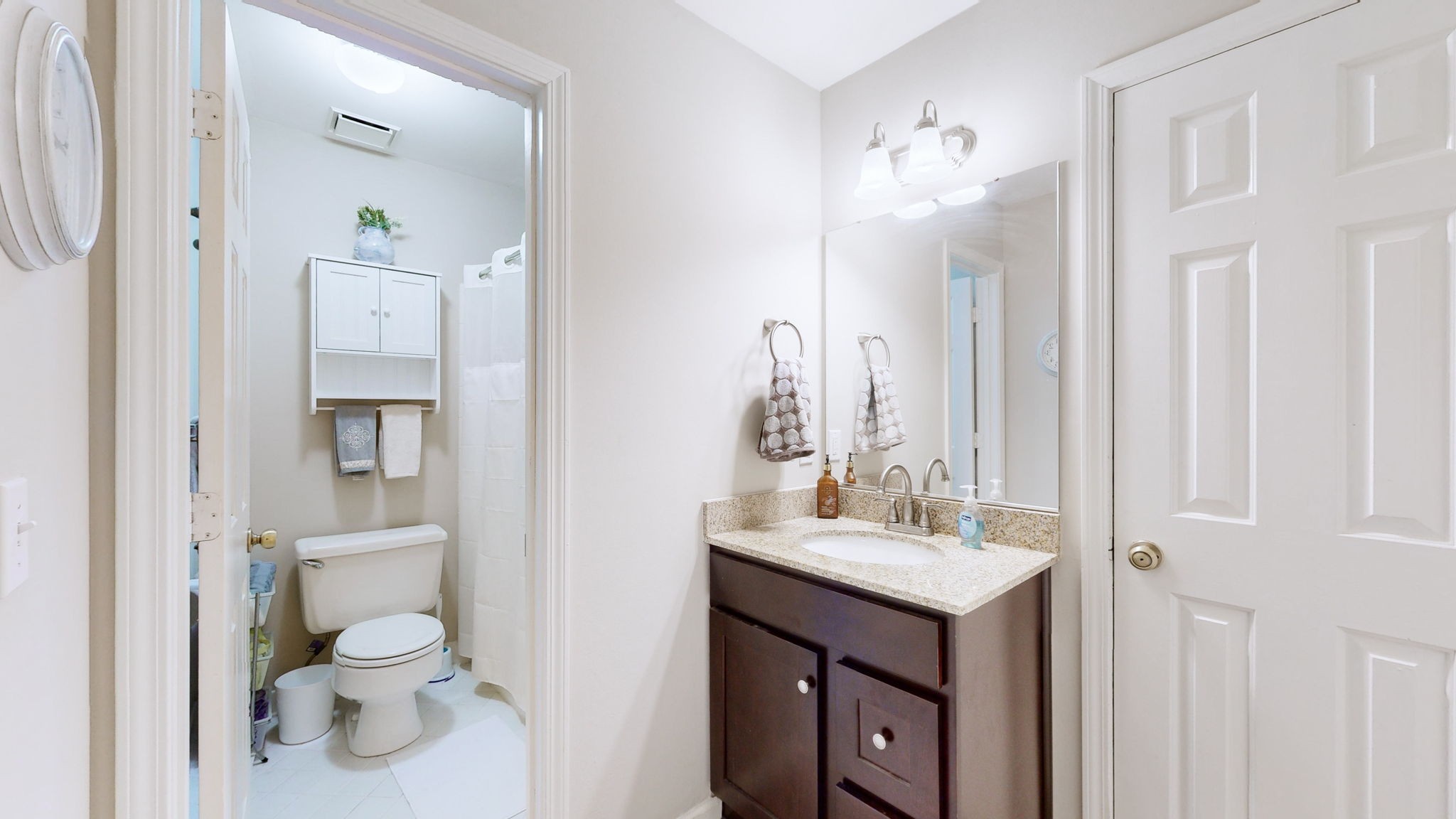 1128 General George Patton Road Nashville, TN 37221 - Photo 22 of 27 a bathroom with a toilet sink and mirror