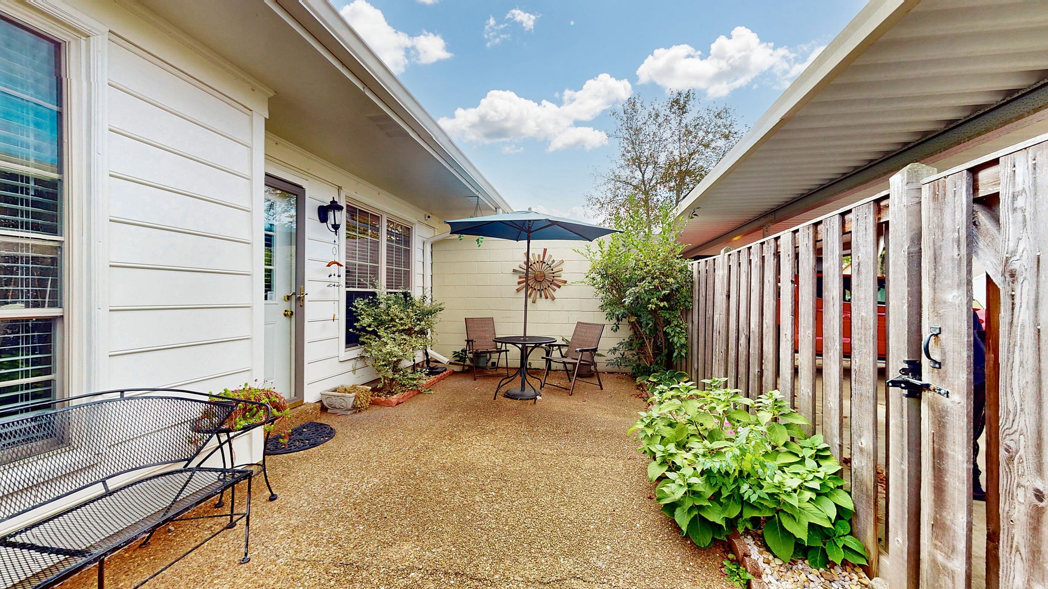 1128 General George Patton Road Nashville, TN 37221 - Photo 25 of 27 a view of a patio with table and chairs and potted plants