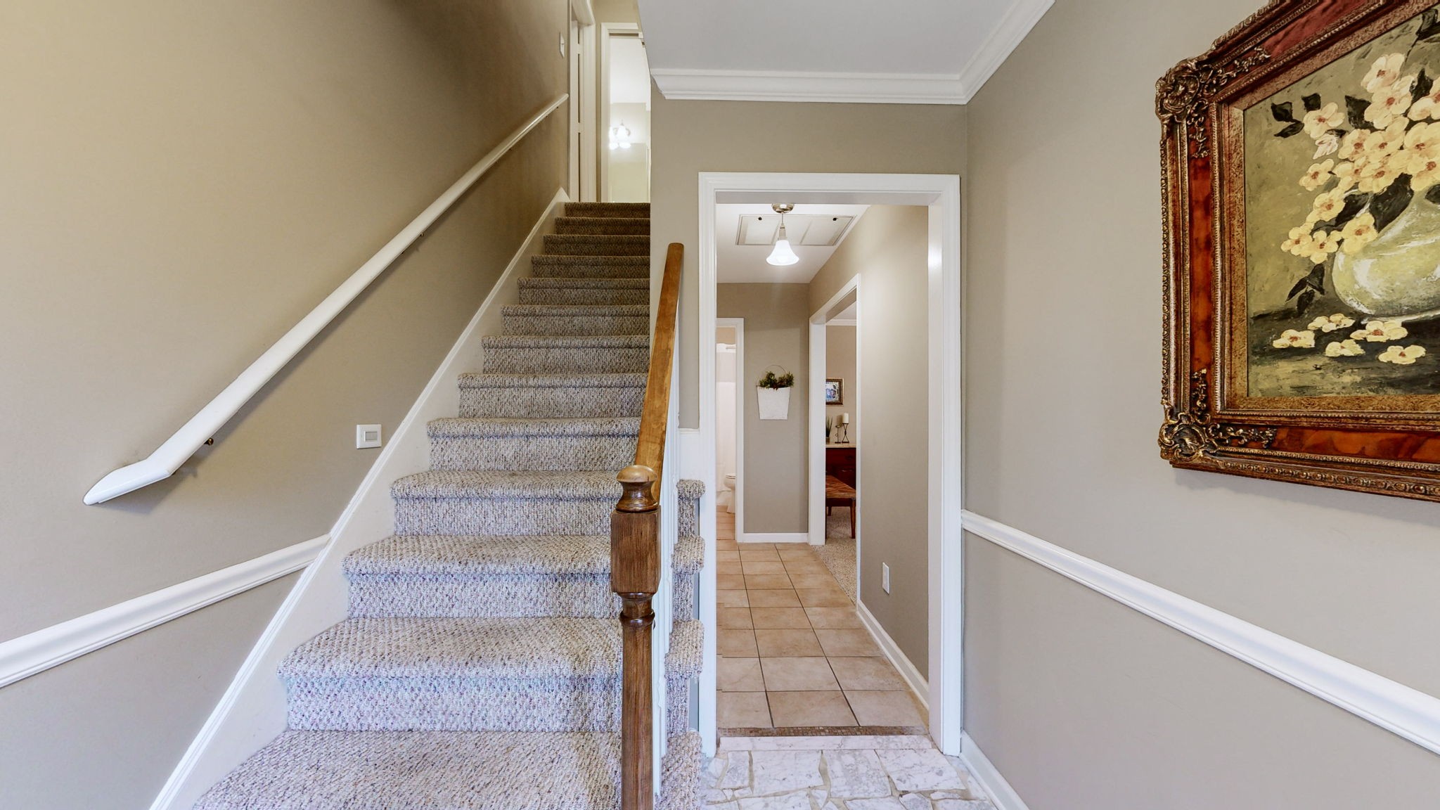 1128 General George Patton Road Nashville, TN 37221 - Photo 7 of 27 a view of a hallway with wooden floor and staircase