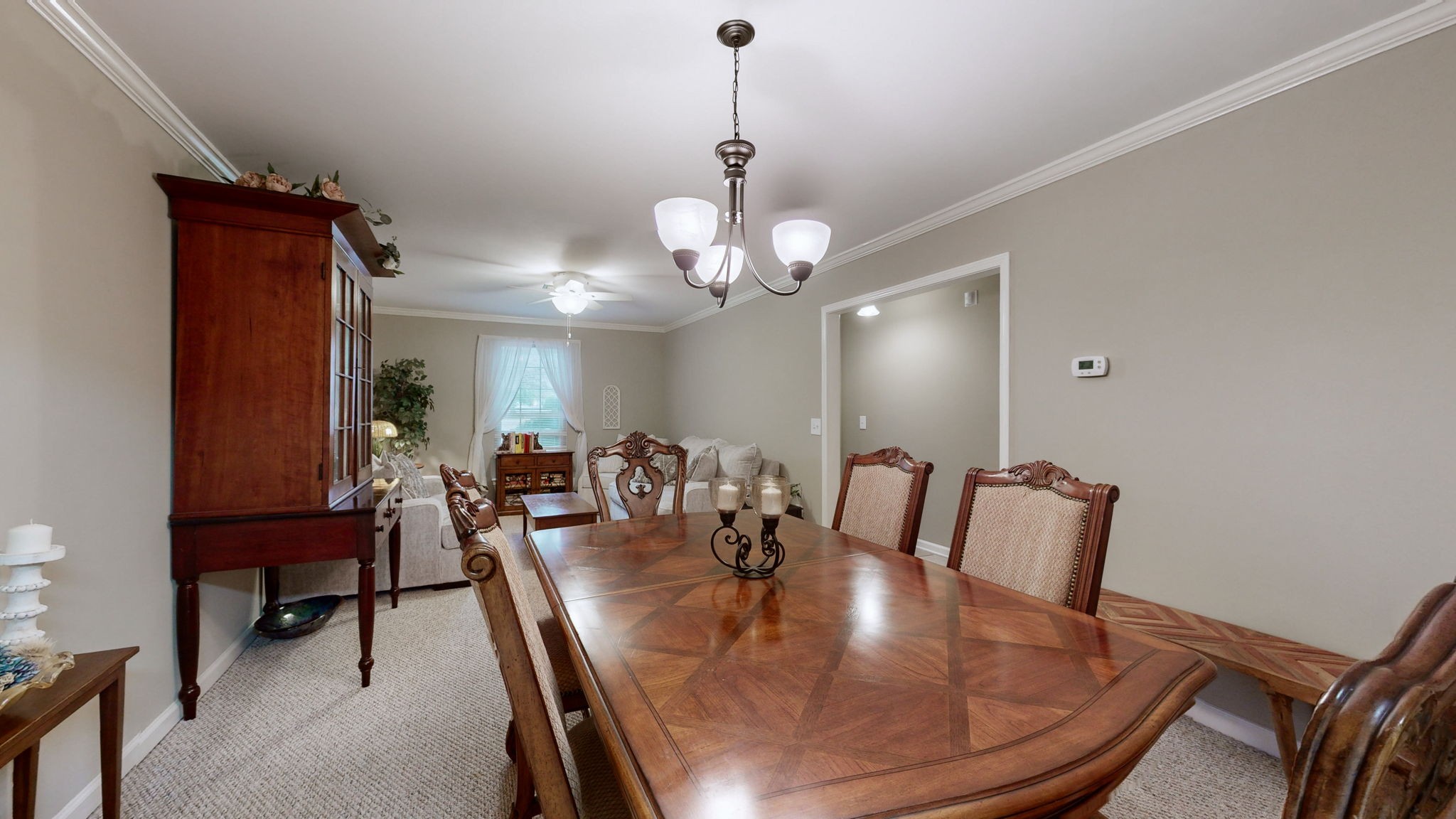 1128 General George Patton Road Nashville, TN 37221 - Photo 9 of 27 a dining room with furniture and chandelier
